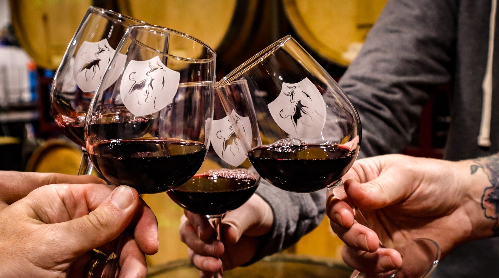 Etched wine glasses clinking together