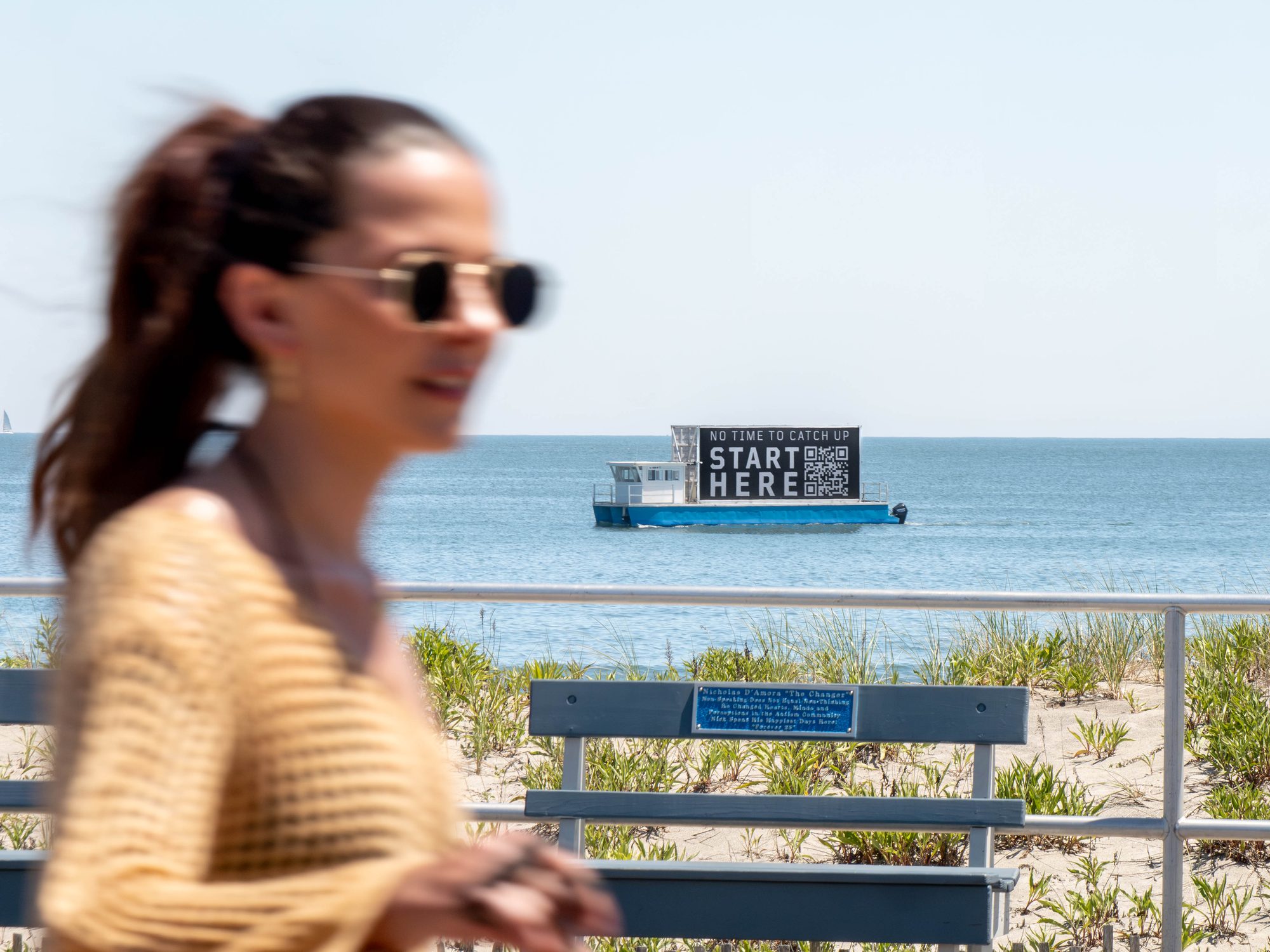 Boardwalk lifestyle shot with billboard boat
